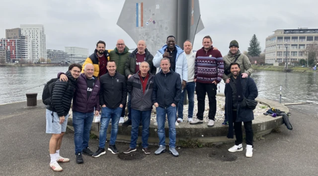 Aston Villa fans stand in front of the Dreiländereck monument in Basle