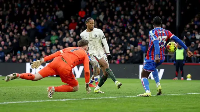 Chelsea forward Joao Pedro's shot at goal strikes the arm of Crystal Palace defender Jaydee Canvot