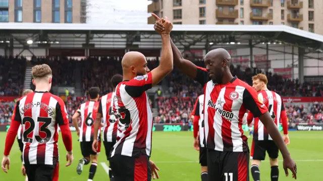 Bryan Mbeumo of Brentford celebrates with teammate Yoane Wissa after scoring his team's third goal from the penalty spot during the Premier League match between Brentford FC and Ipswich Town FC at Gtech Community Stadium on October 26, 2024