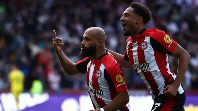 Bryan Mbeumo holds up his finger in celebration