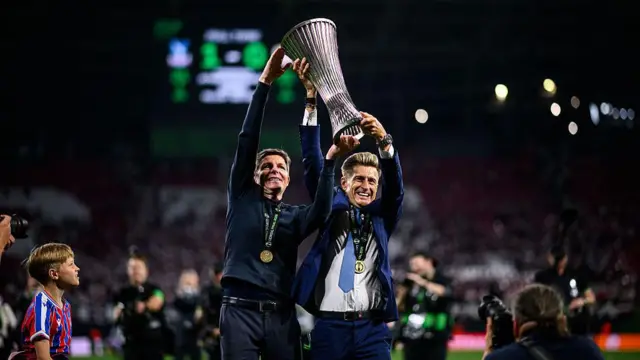 Crystal Palace manager Oliver Glasner and chairman Steve Parish lift the Conference League trophy