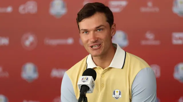 Rasmus Hojgaard talks to the media at Bethpage