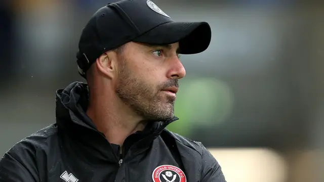 Ruben Selles wearing a Sheffield United jacket and cap