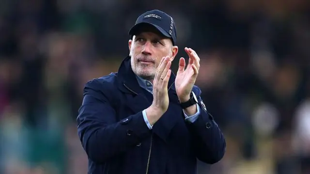 Norwich City head coach Philippe Clement applauds travelling supporters at Preston North End.