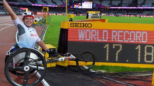 Cockroft celebrates next to the clock after setting new world record