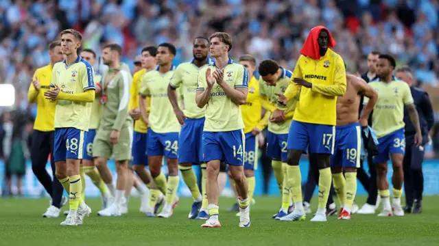 Southampton players applaud the fans after losing to Manchester City at Wembley