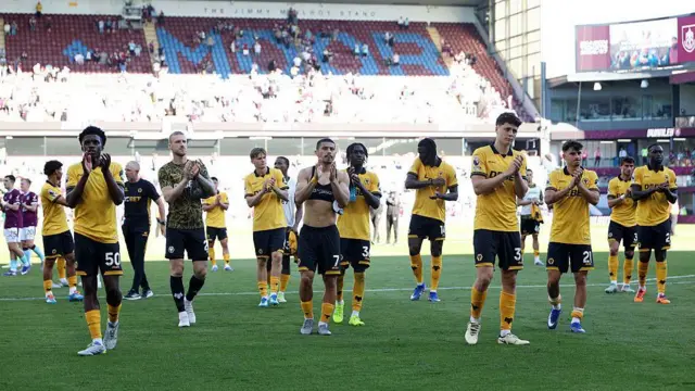 Wolves players applaud fans after final match of the season
