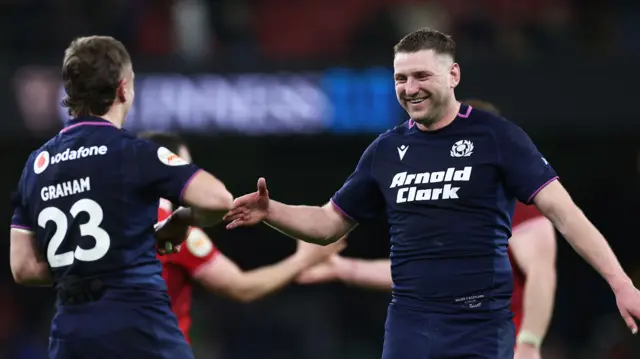 Darcy Graham and Finn Russell celebrate