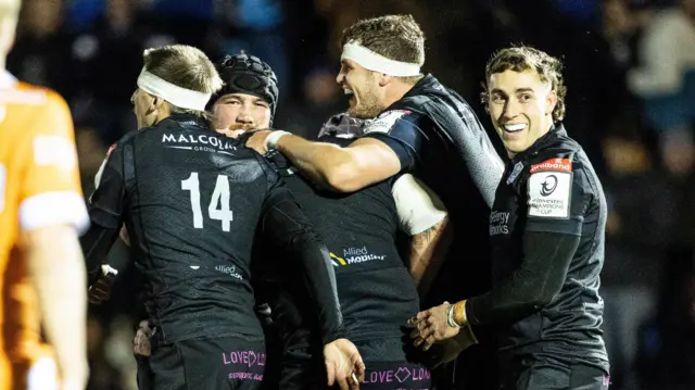 Glasgow celebrate during their Champions Cup win over Sale