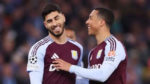Marco Asensio interacts with Youri Tielemans