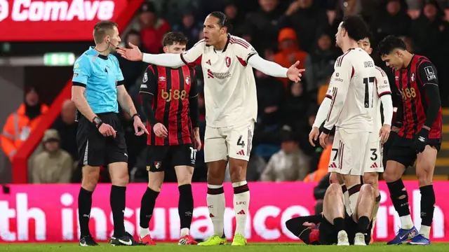 Virgil van Dijk of Liverpool complains to referee Michael Salisbury