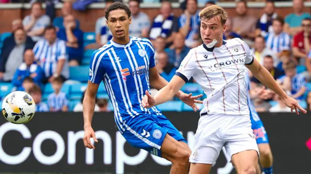 Kilmarnock's Marcus Dackers and Dundee's Ryan Astley