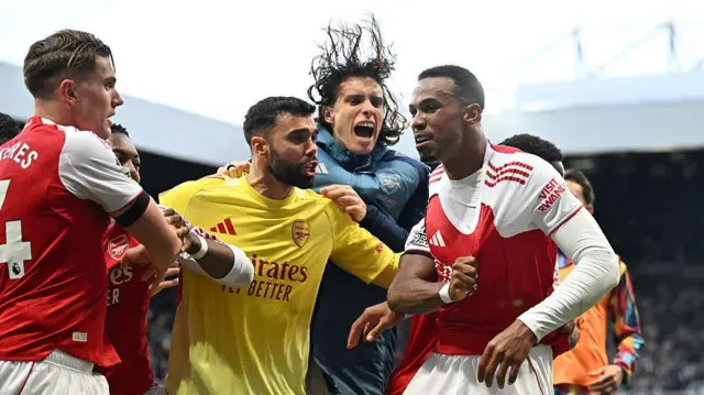Arsenal players celebrate a goal