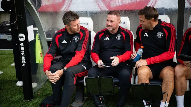 Michael Carrick sits in the dugout ahead of the pre-season friendly match against Rosenborg