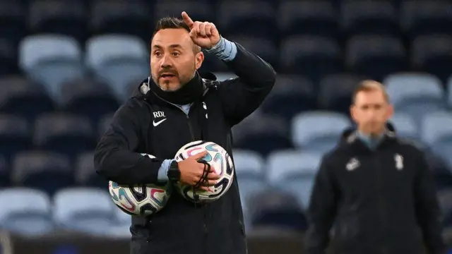 Tottenham Hotspur head coach Roberto De Zerbi gives instructions