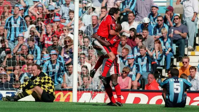 Steve Ogrizovic of Coventry City looks dejected while Kevin Campbell and Dean Saunders of Nottingham Forest celebrate