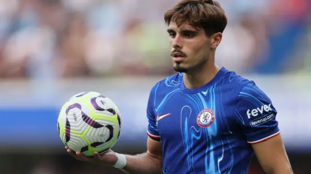 Pedro Neto with a Premier League ball in his hand