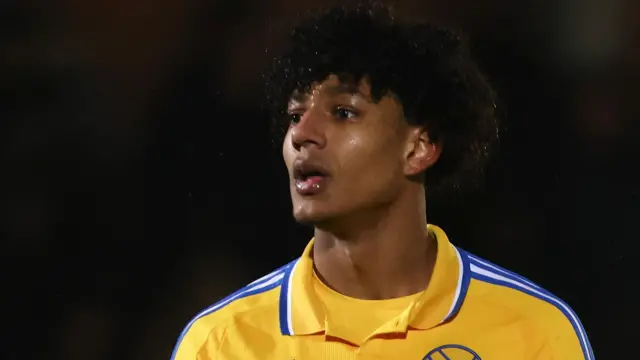 Reuben Lopata-White in the yellow shirt of Leeds' U21 side