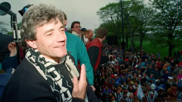 A  smiling Kevin Keegan during an open-top bus parade in Newcastle in May 1993