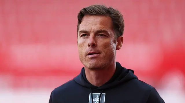 Scott Parker wears a Burnley hoodie