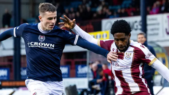 Dundee's Finlay Robertson and St Johnstone's Andre Raymond