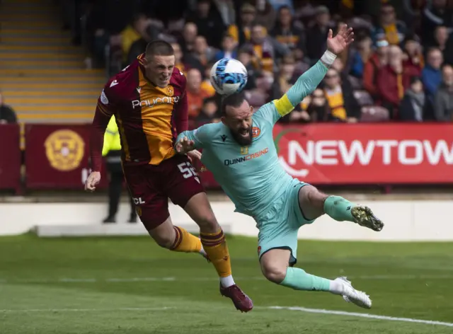 Dan Casey battles with Steven Fletcher during a cinch Premiership match between Motherwell and Dundee United