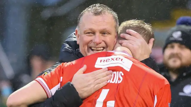 Magilton hugging Addis