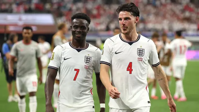Bukayo Saka #7 and Declan Rice #4 of England