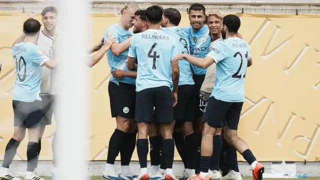 Erling Haaland centre-forward of Manchester City and Norway celebrates with his team-mates in front of the goalposts after scoring against Juventus