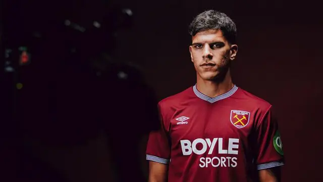 Mateus Fernandes looks on during photoshoot in West Ham shirt