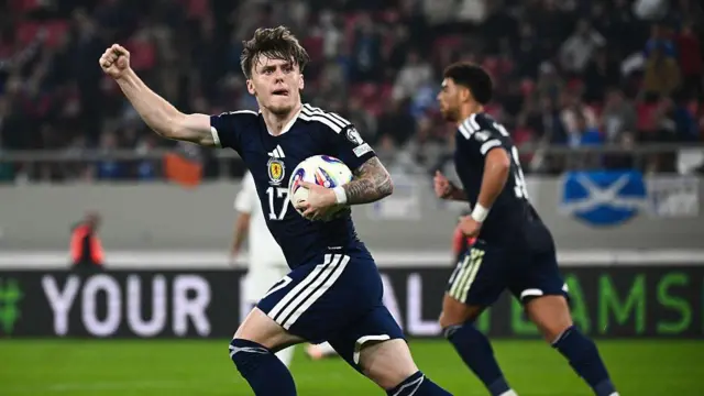 Scotland forward #17 Ben Gannon-Doak (L) celebrates after scoring