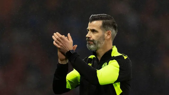 Motherwell manager Stuart Kettlewell applauding fans at Hampden