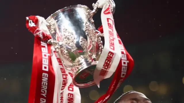 The Carabao Cup with ribbons in the colour of last season's winners Liverpool