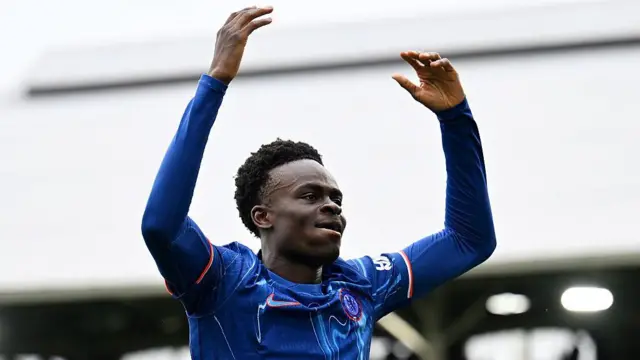 Tyrique George celebrates scoring for Chelsea against Fulham, with his arms aloft