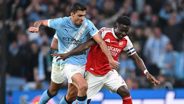 Manchester City's Rodri and Arsenal's Bukayo Saka in action