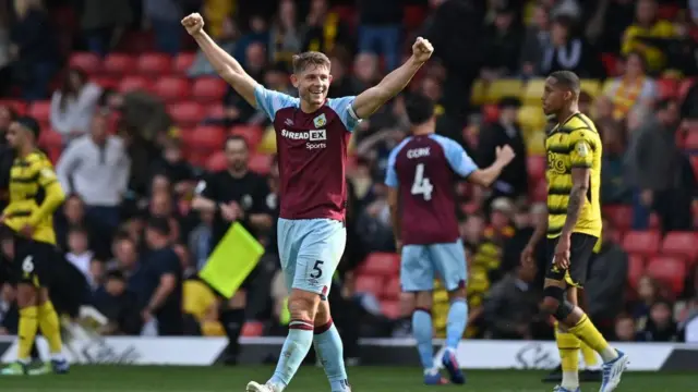 Burnley's English defender James Tarkowski celebrates on the final whistle in a Premier League football match
