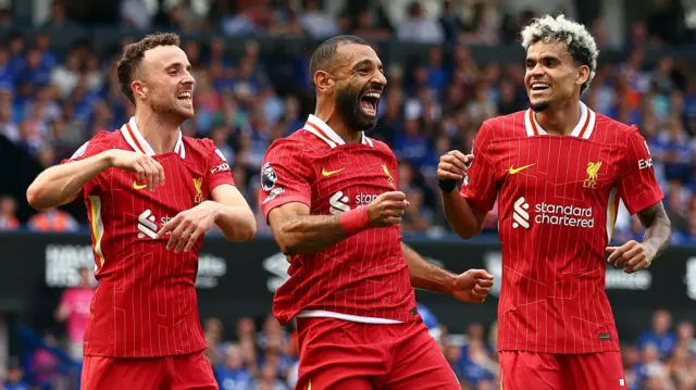 Liverpool players celebrate a goal