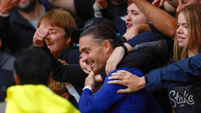Jack Grealish of Everton is mobbed by supporters