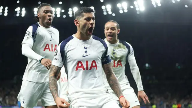 Cristian Romero celebrates with his Spurs teammates