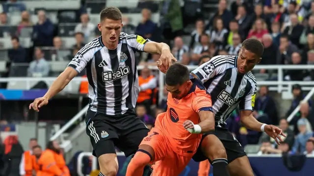 Sven Botman and Mlick Thiaw in action for Newcastle against Barcelona