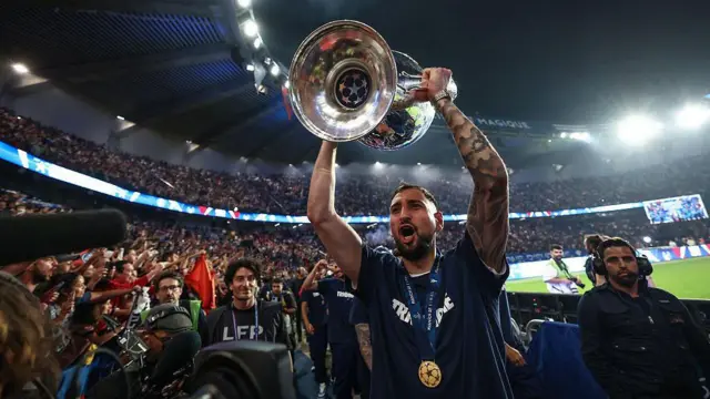 Gianluigi Donnarumma lifts the Champions League trophy