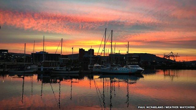 Orange sunset by a harbour