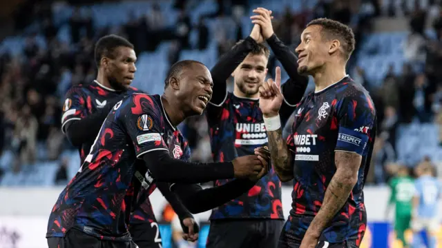 Rangers defender Neraysho Kasanwirjo celebrates with captain James Tavernier