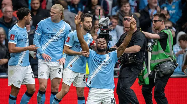 Manchester City celebrate a goal in the FA Cup final