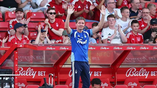 Oliver Glasner waves to the fans during the pre-season friendly match