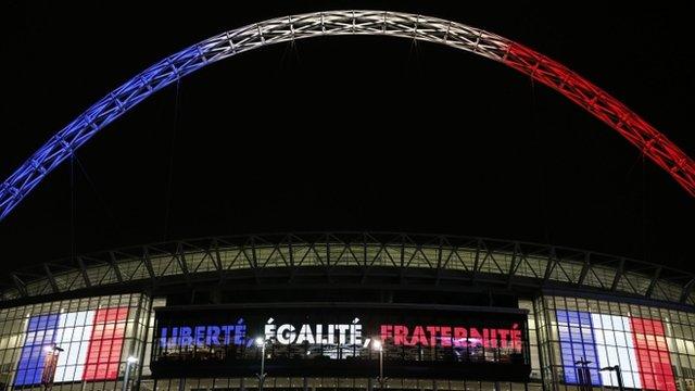 Wembley Stadium with the words 'Liberte, Egalite, Fraternite' written across it