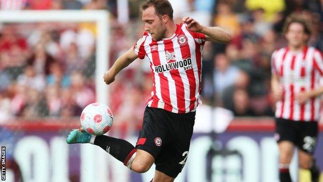 Christian Eriksen kicks the ball