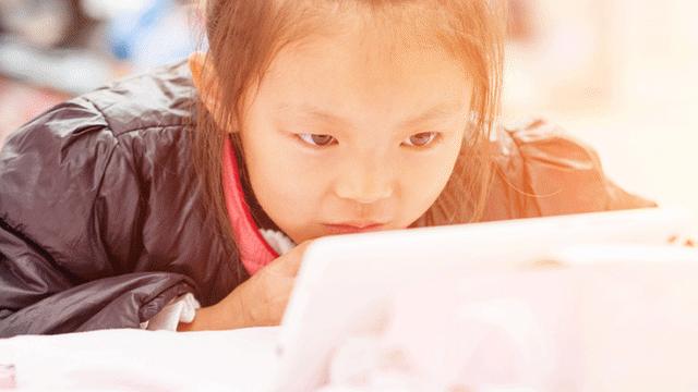 Girl looking at screen