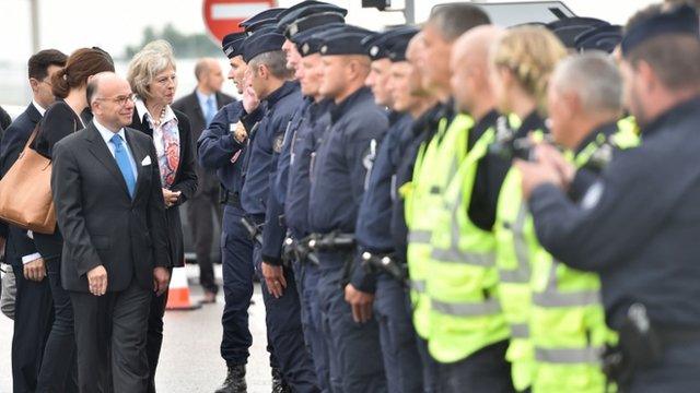 Theresa May inspecting security in Calais