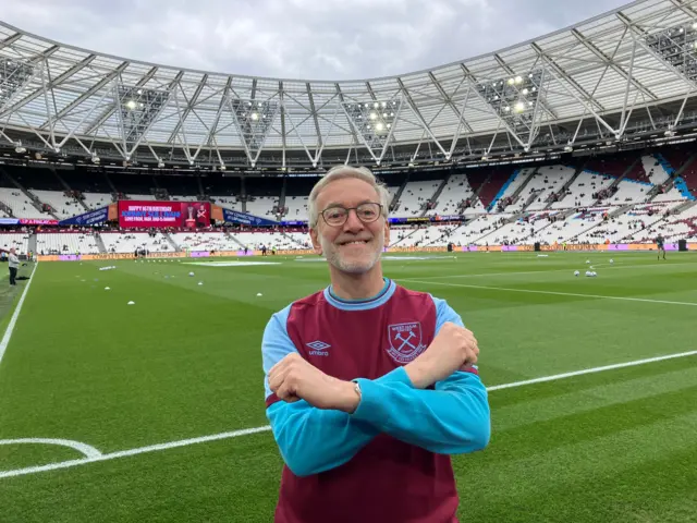 West Ham supporter posing at London Stadium before a game